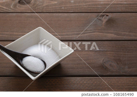 salt and wooden spoon 108165490
