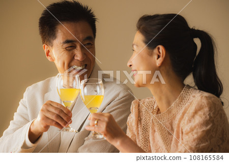 Senior couple drinking alcohol Senior couple drinking alcohol 108165584
