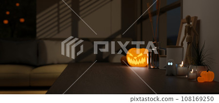 Close-up image of an empty space and accessories on a tabletop in a dark living room at night. 108169250