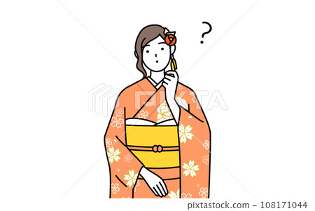 A woman in a long-sleeved kimono tilts her head in question, at a New Year's shrine visit, a coming-of-age ceremony, a graduation ceremony, a wedding, etc. 108171044
