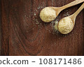Top view two spoons of brown sweet  sugar  on wooden table with copy space. 108171486