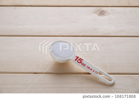 one tablespoon of salt with a measuring spoon one tablespoon of salt with a measuring spoon 108171808