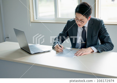 businessman writing documents businessman writing documents 108172974
