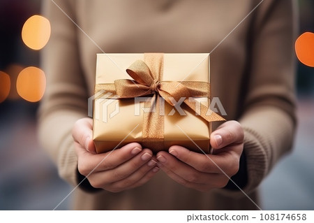Focus on a woman's hand offering a gift with a ribbon on different places Generative AI 108174658
