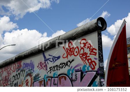 Graffiti and blue sky on the Berlin Wall, Germany.1 Graffiti and blue sky on the Berlin Wall, Germany.1 108175352