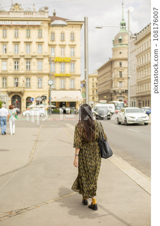 A woman walking along the streets of Vienna, Austria.2 A woman walking along the streets of Vienna, Austria.2 108176007