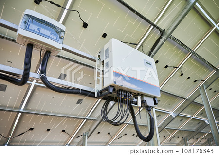 Starting work of solar panel. Solar inverter converting output current to alternating. Back view of photovoltaic panel. Starting work of solar panel. Solar inverter converting output current to alternating. Back view of photovoltaic panel. 108176343