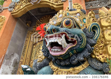 Traditional old ancient Balinese statue of demon angel called barong bali guarding sacred ritual temple 108176846