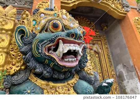 Traditional old ancient Balinese statue of demon angel called barong bali guarding sacred ritual temple 108176847