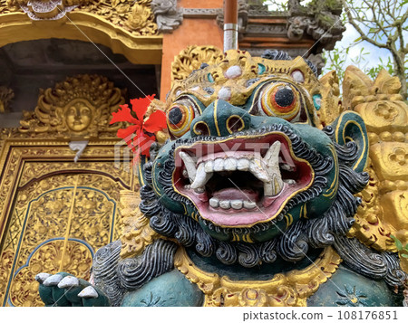 Traditional old ancient Balinese statue of demon angel called barong bali guarding sacred ritual temple Traditional old ancient Balinese statue of demon angel called barong bali guarding sacred ritual temple 108176851