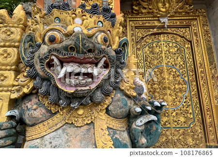Traditional old ancient Balinese statue of demon angel called barong bali guarding sacred ritual temple 108176865