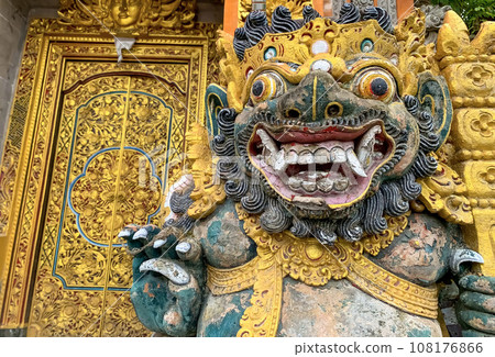 Traditional old ancient Balinese statue of demon angel called barong bali guarding sacred ritual temple 108176866