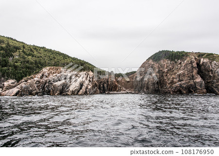 A panoramic view of the Cape Breton Island Coast line cliff scenic Cabot Trail route, Nova Scotia Hghlands Canada A panoramic view of the Cape Breton Island Coast line cliff scenic Cabot Trail route, Nova Scotia Hghlands Canada 108176950