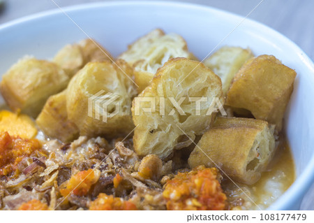 Bubur ayam or chicken porridge is a popular Indonesian breakfast porridge. 108177479