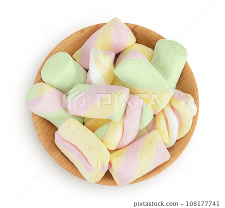 Colorful mini marshmallows in wooden bowl isolated on white background with full depth of field. Top view. Flat lay Colorful mini marshmallows in wooden bowl isolated on white background with full depth of field. Top view. Flat lay 108177741