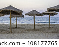 Natural beach umbrellas, on a empty beach in the Mediterranean, in the early evening	 108177765