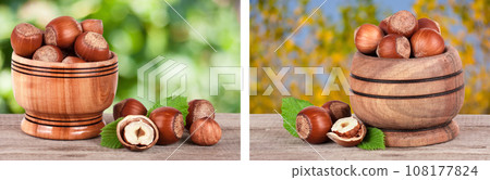 Hazelnuts with leaves in a wooden bowl on a wooden table with blurred garden background Hazelnuts with leaves in a wooden bowl on a wooden table with blurred garden background 108177824