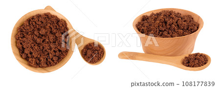 Dark muscovado sugar or Barbados sugar in wooden bowl isolated on white background. Top view. Flat lay Dark muscovado sugar or Barbados sugar in wooden bowl isolated on white background. Top view. Flat lay 108177839