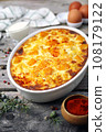 French cuisine. Vegetable pumpkin clafoutis in ceramic bakeware, smoked paprika dressing, eggs and cream 108179122