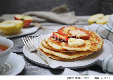 French cuisine. Matefaim. Sweet Apple Pancakes, butter and caramelized apples French cuisine. Matefaim. Sweet Apple Pancakes, butter and caramelized apples 108179157
