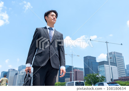 Middle-aged businessman commuting to the office Middle-aged businessman commuting to the office 108180634