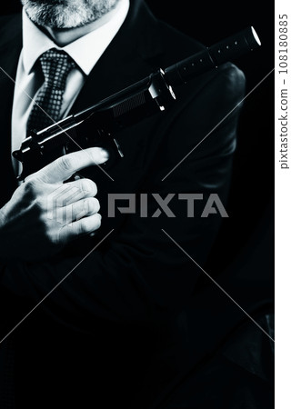 Elegant man holding gun Elegant man holding gun 108180885