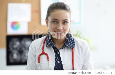 Cheerful attractive female at working place 108180985
