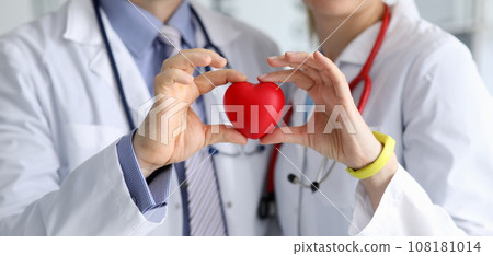 Doctors showing heart symbol 108181014