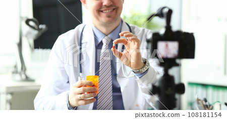 Doctor holding tablets Doctor holding tablets 108181154
