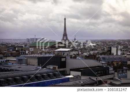 View of the Eiffel Tower rising above the cloudy sky View of the Eiffel Tower rising above the cloudy sky 108181247