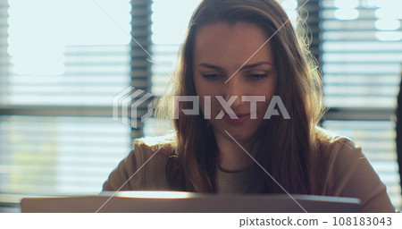 Woman remote job from home office typing laptop. Female browsing internet, using laptop computer at home. Freelancer working on. Woman remote job from home office typing laptop. Female browsing internet, using laptop computer at home. Freelancer working on. 108183043