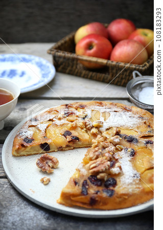 French cuisine. Matefaim. Sweet Apple Pancake with dried cranberries and walnuts for breakfast French cuisine. Matefaim. Sweet Apple Pancake with dried cranberries and walnuts for breakfast 108183293