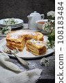 French cuisine. Matefaim. Stack of sweet Apple Pancakes, cup of tea and white spring flowers 108183484