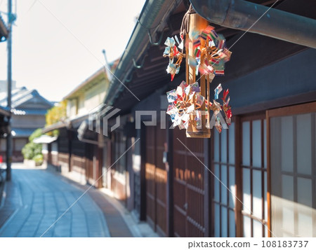 Bamboo windmill swinging under the eaves of Takehara's old townscape 108183737