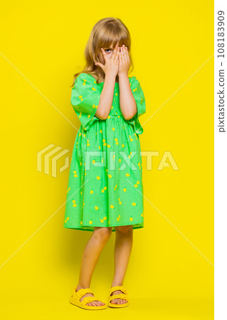 Child girl kid closing eyes with hands, spying through fingers, hiding peeping, seeking something Child girl kid closing eyes with hands, spying through fingers, hiding peeping, seeking something 108183909