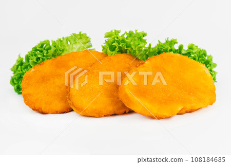 Chicken Breaded Fillet. Breaded chicken nuggets. Fast homemade food at home. Chicken breaded schnitzels. Breaded Chicken Inner Fillet on a White Background,Chicken Breaded Raw Meat. Fast cooking. 108184685