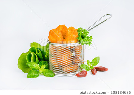 Breaded Chicken Inner Fillet with green lettuce leaves on a White Background,Chicken Breaded Raw Meat,Fillet.Breaded chicken nuggets. Fast homemade food at home.Chicken breaded schnitzels.Fast cooking Breaded Chicken Inner Fillet with green lettuce leaves on a White Background,Chicken Breaded Raw Meat,Fillet.Breaded chicken nuggets. Fast homemade food at home.Chicken breaded schnitzels.Fast cooking 108184686