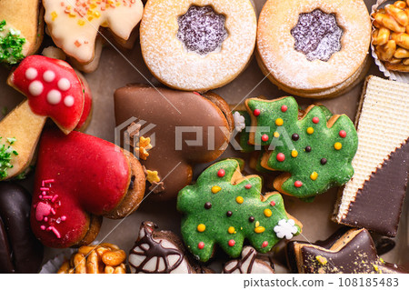 traditional Christmas pastries and cakes with chocolate, Christmas preparations and baking traditional Christmas pastries and cakes with chocolate, Christmas preparations and baking 108185483