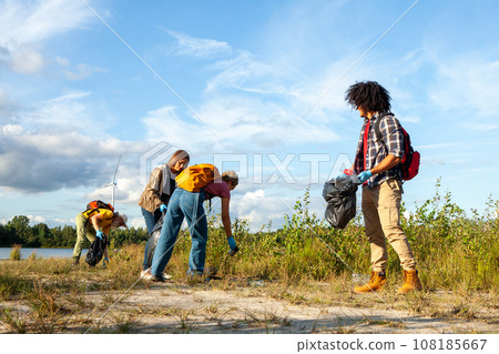 Unity for Nature: Multicultural Volunteers Cleaning the Forest 108185667