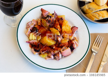 Galician style octopus, tradicional Spanish dish, served on plate 108185985
