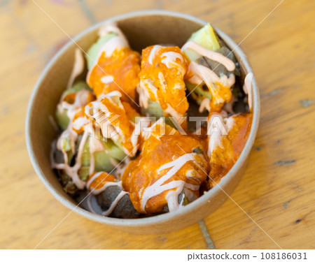 Spanish fried potatoes Patatas bravas served with cheese sauce Spanish fried potatoes Patatas bravas served with cheese sauce 108186031
