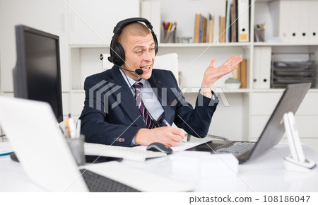 Portrait of friendly man call center operator Portrait of friendly man call center operator 108186047