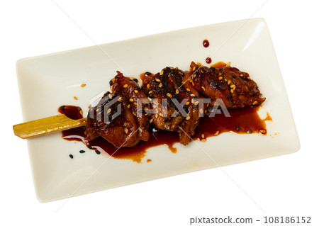 Traditional Yakitori made of chicken pieces served in a plate Traditional Yakitori made of chicken pieces served in a plate 108186152