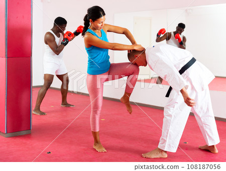 Woman inflicts painful blows on man during self-defense lesson for women Woman inflicts painful blows on man during self-defense lesson for women 108187056