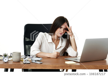 businesswoman reading bad news at laptop and thinking about troubles businesswoman reading bad news at laptop and thinking about troubles 108187217