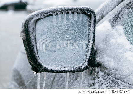 car covered with ice after snowstorm car covered with ice after snowstorm 108187525