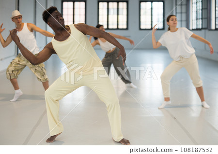 Afro american man dancing modern dance Afro american man dancing modern dance 108187532