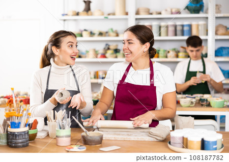 Two young women making pottery in workshop Two young women making pottery in workshop 108187782