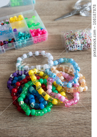 Close-up of a decorative bracelet of colorful beads 108187878