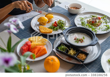eating delicious breakfast at restaurant eating delicious breakfast at restaurant 108188256